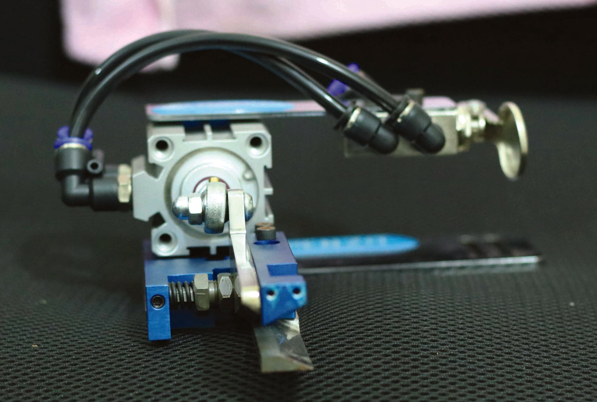 Tape Thread Cutting System with Button - Empenzo Automated Sewing Systems