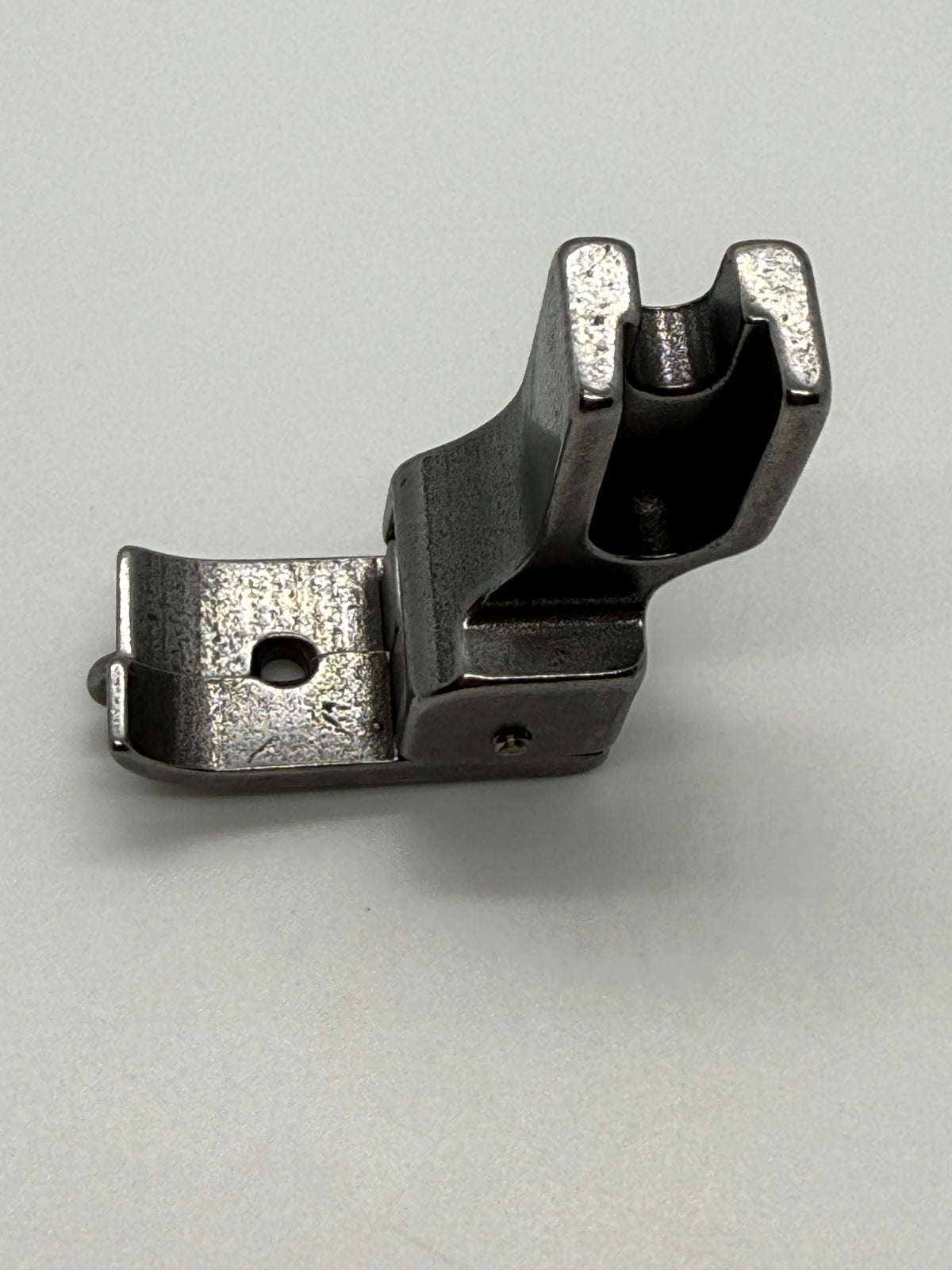 Left Close Seam Comp - Industrial Sewing Machine Part NL-31S