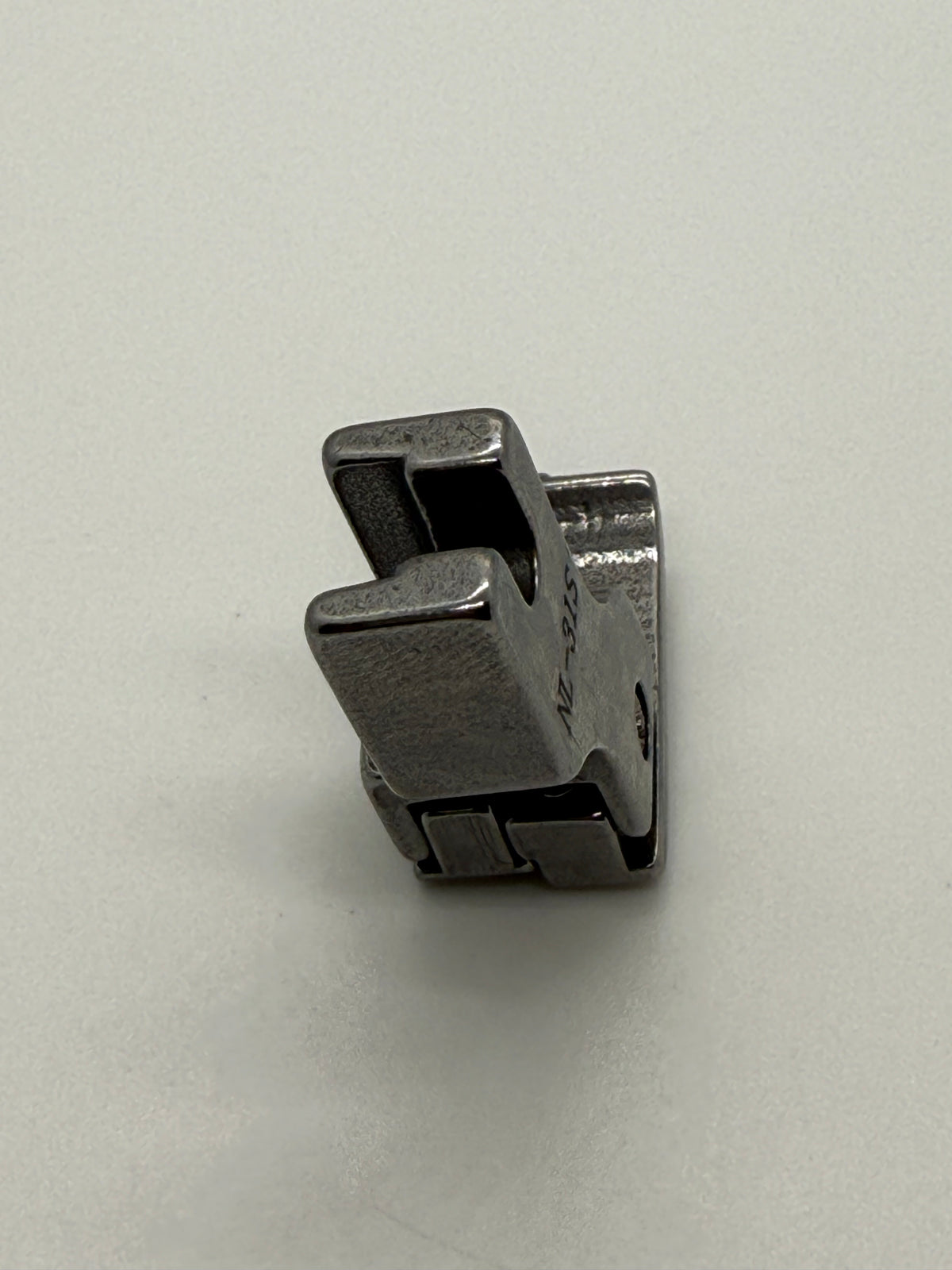 Left Close Seam Comp - Industrial Sewing Machine Part NL-31S