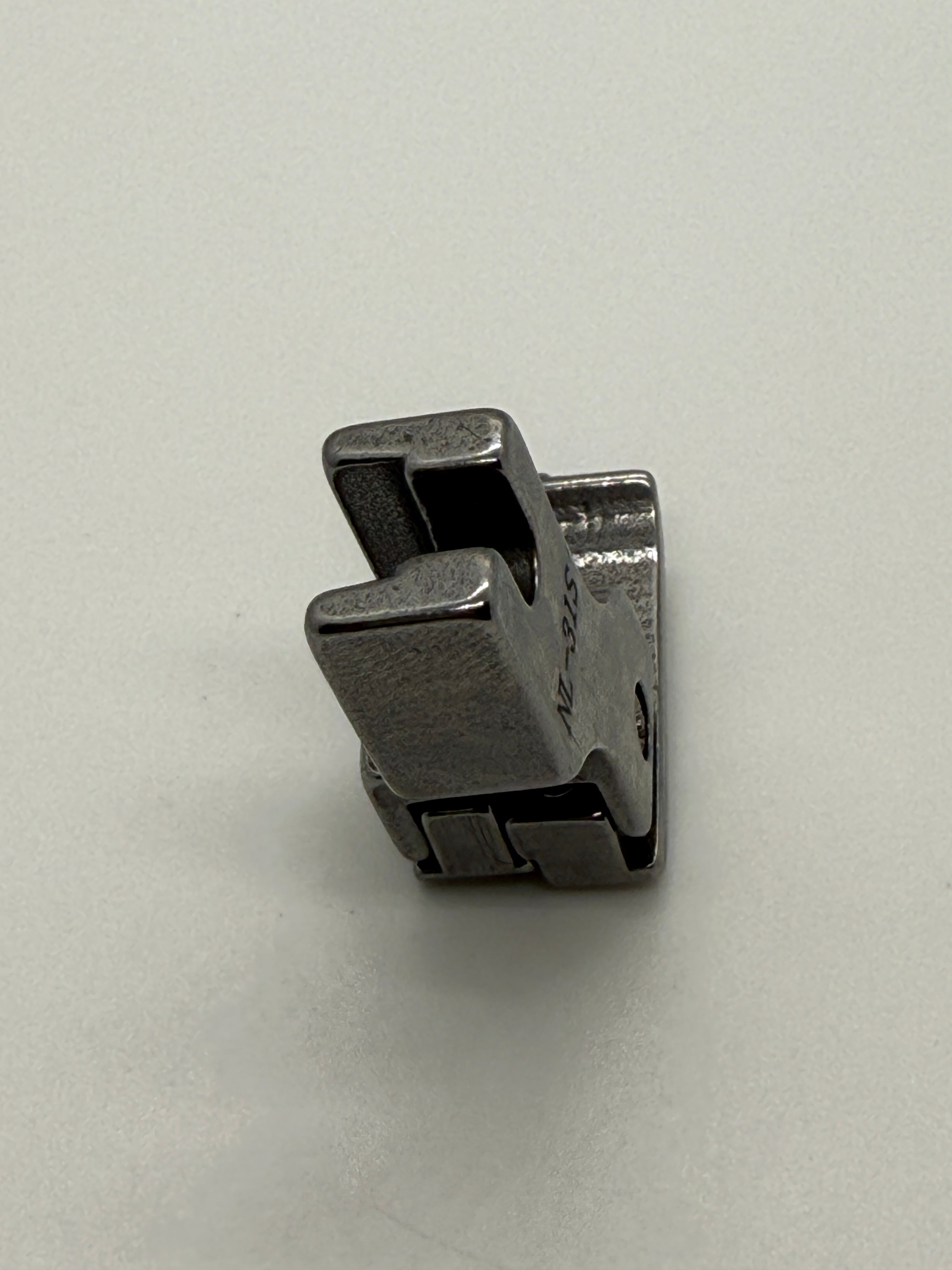 Left Close Seam Comp - Industrial Sewing Machine Part NL-31S