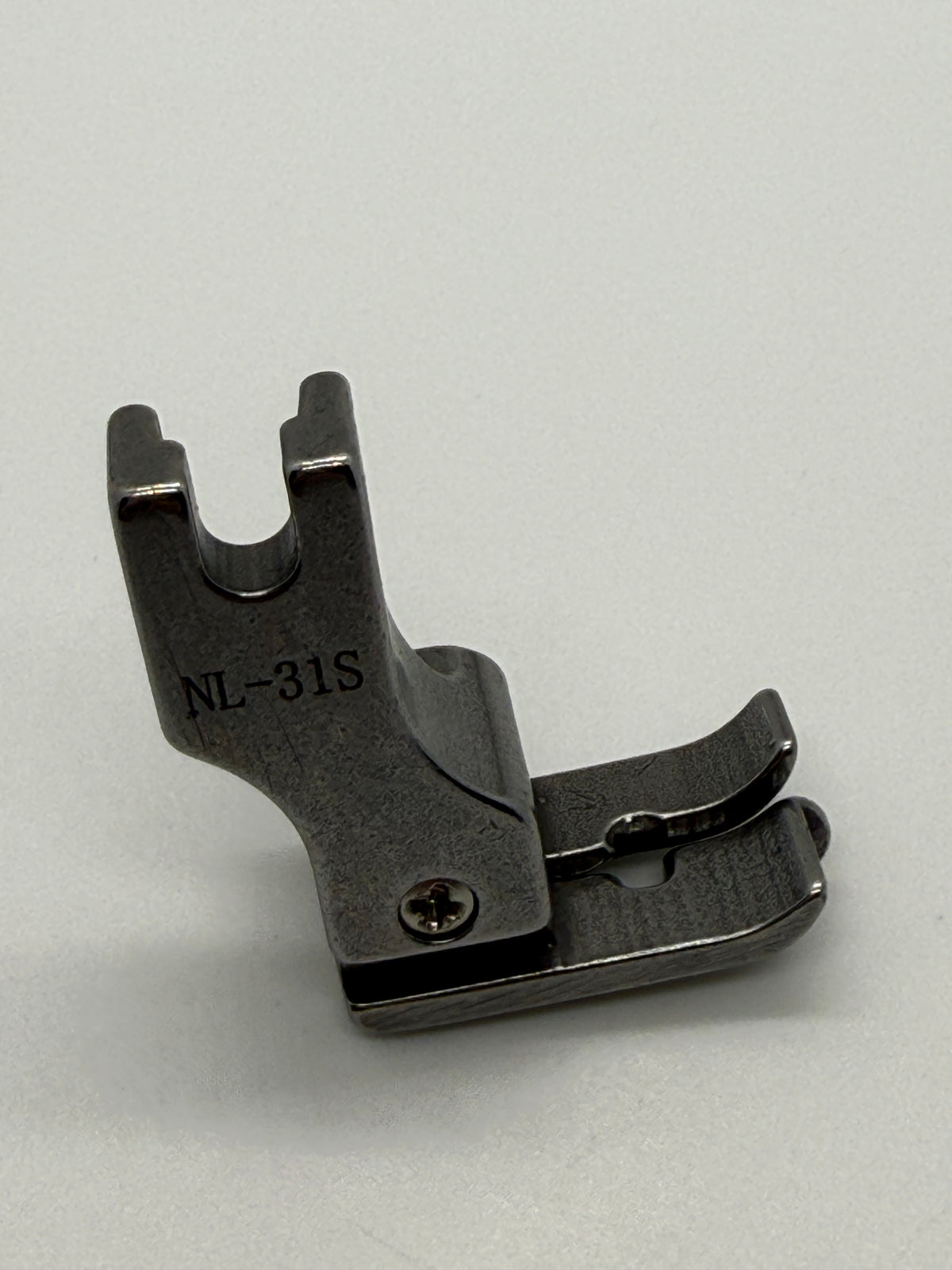 Left Close Seam Comp - Industrial Sewing Machine Part NL-31S