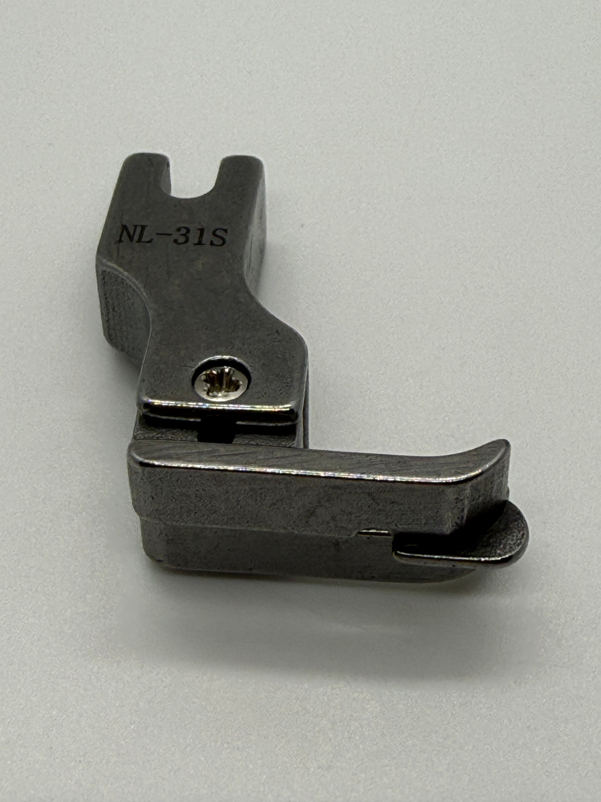 Left Close Seam Comp - Industrial Sewing Machine Part NL-31S
