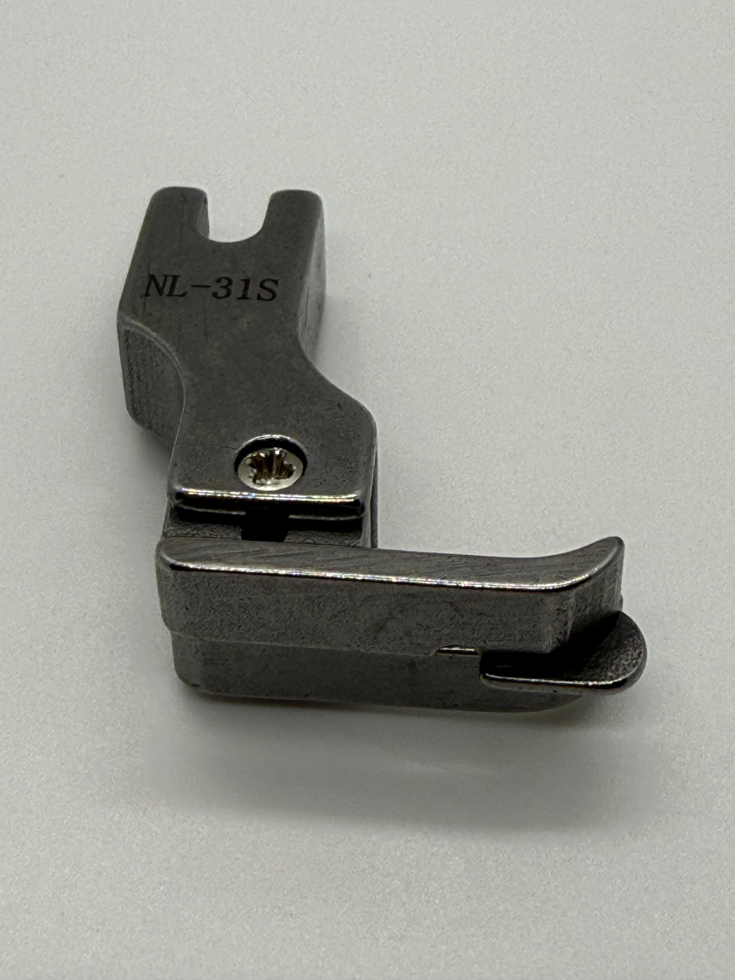 Left Close Seam Comp - Industrial Sewing Machine Part NL-31S