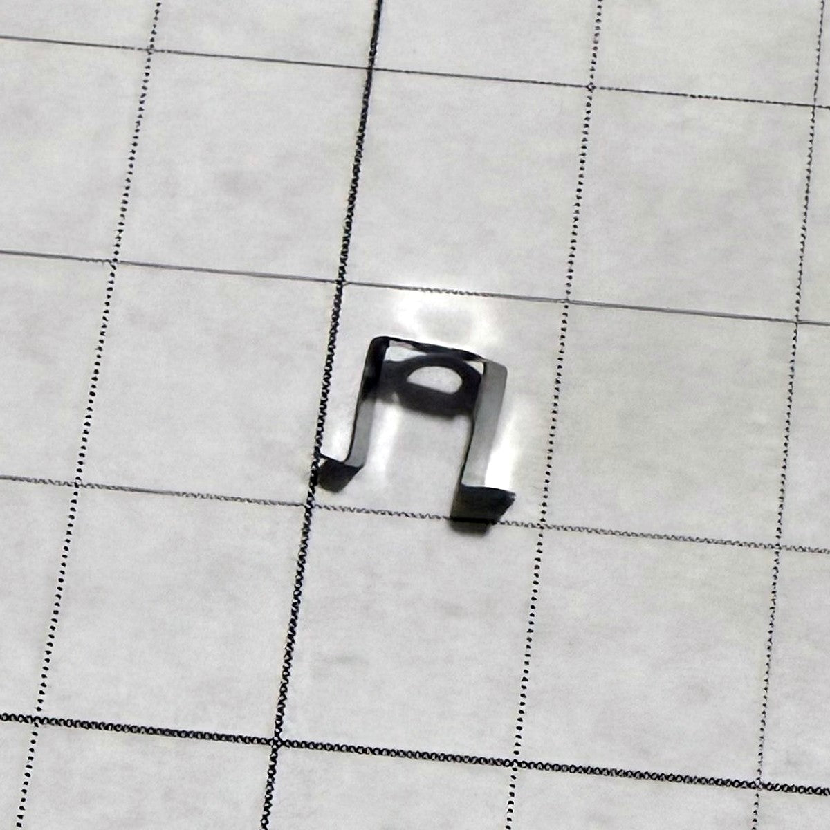 Needle Clamp Plate XC2426020 for Brother - actual photo